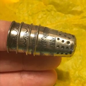 Four real silver thimbles